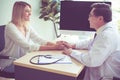 Doctor giving a consultation and encouragement to patient,Hands woman doctor reassuring her female patient in hospital room,Mental Royalty Free Stock Photo