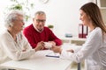 Doctor giving drugs to her senior woman patient Royalty Free Stock Photo