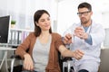 doctor giving female patient injection against virus