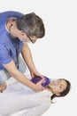 Doctor giving first aid to female pacient