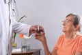 Doctor giving a glass of water to a patient Royalty Free Stock Photo