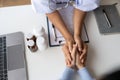 Doctor giving hope. Close up shot of young female physician leaning forward to smiling elderly lady patient holding her Royalty Free Stock Photo