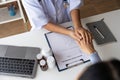 Doctor giving hope. Close up shot of young female physician leaning forward to smiling elderly lady patient holding her Royalty Free Stock Photo