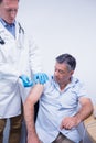 Doctor giving injection to his patient Royalty Free Stock Photo