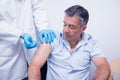 Doctor giving injection to his patient Royalty Free Stock Photo