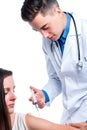 Doctor giving injection to patient. Royalty Free Stock Photo