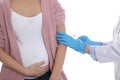 Doctor giving injection to pregnant woman on background, closeup. Vaccination concept