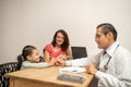 doctor giving a lollipop to a little girl as a reward. Pediatrician giving a candy to a child, building kid patient confidence Royalty Free Stock Photo