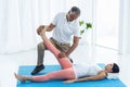 Doctor giving physiotherapy to pregnant woman Royalty Free Stock Photo