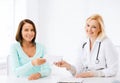 Doctor giving prescription to patient in hospital Royalty Free Stock Photo