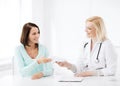 Doctor giving prescription to patient in hospital Royalty Free Stock Photo