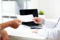 Doctor giving prescription to patient at hospital Royalty Free Stock Photo