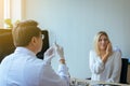 Doctor giving vaccine to woman patient with injection or syringe in hospital room Royalty Free Stock Photo