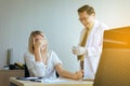 Doctor giving vaccine to women patient with injection or syringe in hospital room Royalty Free Stock Photo