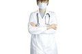 A doctor in glasses, a mask, a dressing gown with a stethoscope around her neck Royalty Free Stock Photo