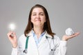 Doctor with glowing light bulb and crumpled paper Royalty Free Stock Photo