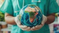 doctor in a green medical robe holding an object in the form of a globe in his hands, concept world health day Royalty Free Stock Photo