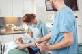 Doctor greeting patient before starting treatment Royalty Free Stock Photo