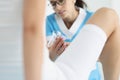 Doctor gynecologist examining woman using medical instrument mirror closeup