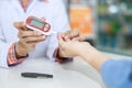 Doctor hand checking blood sugar pressure of patient in hospital Royalty Free Stock Photo