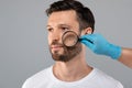 Doctor Hand Checking Face Skin Of Man With Dermatoscope Royalty Free Stock Photo