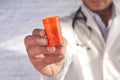Doctor hand holding pill container with copy space Royalty Free Stock Photo