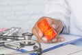doctor hand holding pill container with copy space Royalty Free Stock Photo