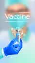 The doctor hand holds an ampoule of vaccine against the virus