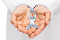 Doctor hand with prostate cancer awareness ribbon