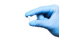 Doctor hand in sterile gloves holding  pill isolated on white background  close up view  - Image Royalty Free Stock Photo