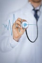 Doctor hand with stethoscope listening heart beat Royalty Free Stock Photo