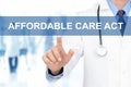 Doctor hand touching AFFORDABLE CARE ACT sign on virtual screen Royalty Free Stock Photo