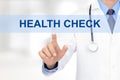 Doctor hand touching HEALTH CHECK sign on virtual screen Royalty Free Stock Photo