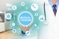 Doctor hand touching MEDICAL TOURISM sign virtual screen