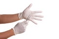 Doctor hand in white latex sterile gloves with forceps isolated Royalty Free Stock Photo