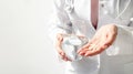 Doctor hands giving white pills and glass of water Royalty Free Stock Photo