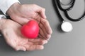 Doctor hands holding and give red massage heart to patient for r Royalty Free Stock Photo