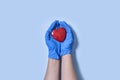 Doctor hands holding heart, donation and implantation, medic saving life