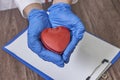 Doctor hands holding heart, donation and implantation, medic saving life