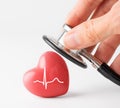 Doctor hands holding red heart and stethoscope. Cardiology, heart health and care, Heart Day concept Royalty Free Stock Photo