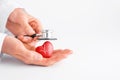 Doctor hands holding red heart and stethoscope. Cardiology, heart health and care, Health Day concept. Royalty Free Stock Photo