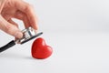 Doctor hands holding red heart and stethoscope. Cardiology, heart health and care, Health Day concept. Copy space Royalty Free Stock Photo