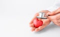 Doctor hands holding red heart and stethoscope. Cardiology, heart health and care, Health Day concept. Copy space Royalty Free Stock Photo