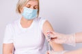 Doctor hands in the laboratory wear sterile gloves holding vaccination needles. Ready to inject the patient to prevent Royalty Free Stock Photo