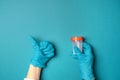Doctor hands in latex gloves hold an empty plastic container and shows like gesture Royalty Free Stock Photo
