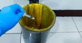 Doctor hands throwing used syringe into medical waste bin in the hospital. Royalty Free Stock Photo