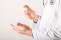 Doctor hands using washing hand with Alcohol Sanitizer on a white background. Protect themselves from virus infection in Corona