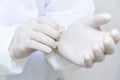 Doctor hands with white surgical gloves, Latex Glove, Rubber glove manufacturing, human hand is wearing a medical glove, prepare Royalty Free Stock Photo