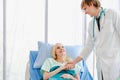 Doctor handshake with a girl patient in a hospital Royalty Free Stock Photo