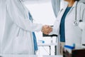 Doctor, handshake and partnership in healthcare, medicine or trust for collaboration, unity or support.Team of medical experts Royalty Free Stock Photo
